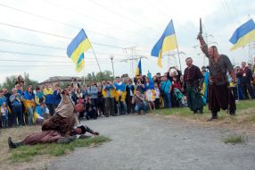 participants  of parade Ukrainian flags