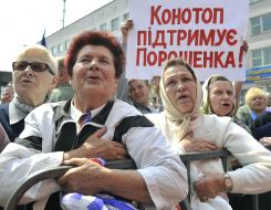 People hold a placard