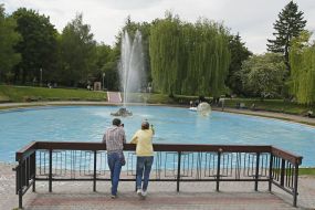 Couple resting near a fountain