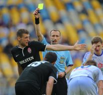 Referee shows a yellow card 