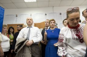 Alexksndr Turchynov with a wife and son on an election district
