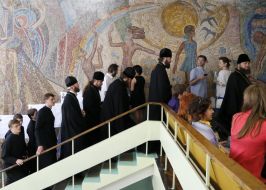 Priests stand in the queue