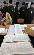Priests stand in the queue