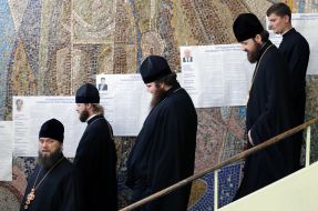 Priests stand in the queue
