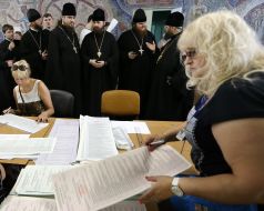 Priests stand in the queue