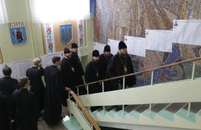 Priests stand in the queue