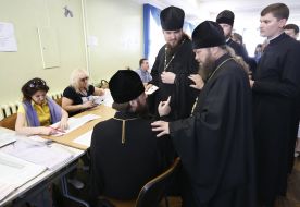 Priests stand in the queue