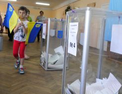 Girl with the small flags of Ukraine