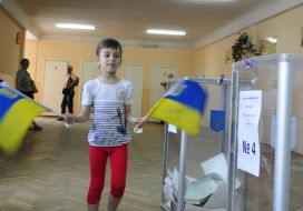 Girl with the small flags of Ukraine