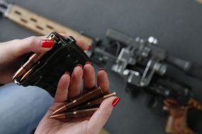 Girl charges ammo in the clip