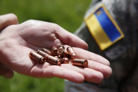 Soldier holding bullet