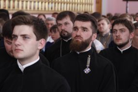 Patriarch Filaret presenting diplomas to students, theologians