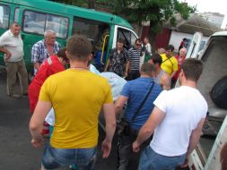 Workers the ambulance near shot car