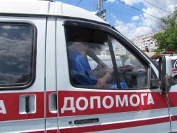 Ambulance near shot car