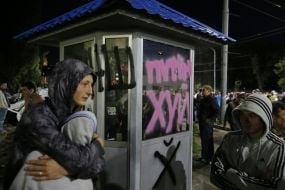 Protesters overturned car
