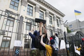 Protesters overturned car