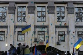 Protesters overturned car