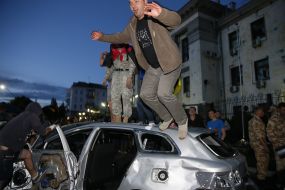 Protesters overturned car