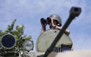 Paratrooper looking through binoculars