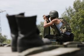 Paratrooper looking through binoculars