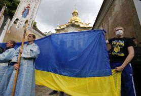 Activists with the flag of Ukraine