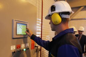 A worker checks the pressure in the gas pipe