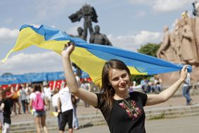 Woman holding a flag of Ukraine