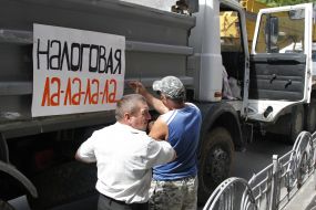 Participant holds a placard picket