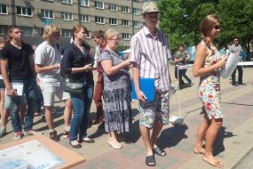 Participants stand in a queue UPE
