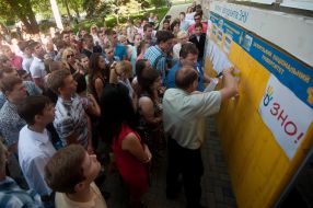 Participants stand in a queue UPE