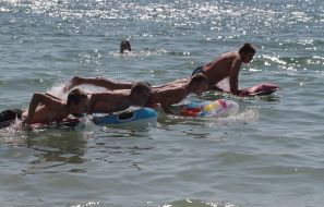 Participants of swim on mattresses