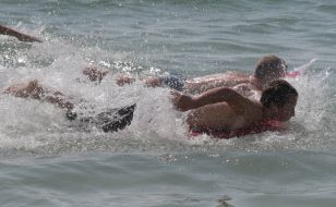 Participants of swim on mattresses