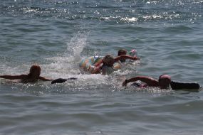 Participants of swim on mattresses