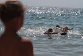 Participants of swim on mattresses