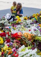 People bring flowers to the Embassy of the Netherlands