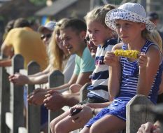 Girl eating boiled corn