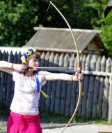 Woman shooting from bow