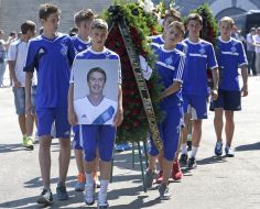 Young athletes carrying a portrait of Valentin Belkevich
