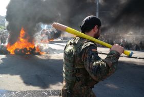 On Independence Square set fire to tires