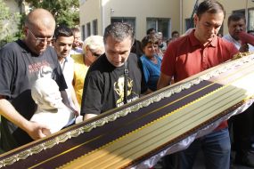 Activists hold a coffin