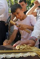 The boy puts the nail in the coffin