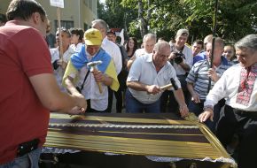 Activists drive nails in the coffin