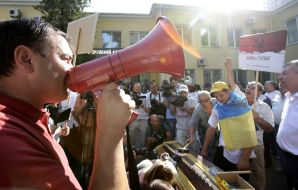 Activists drive nails in the coffin