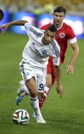 Younes Belhanda and Andrew Oberemko