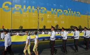 Students carry uncompressed flag of Ukraine
