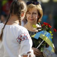 A woman holds flags