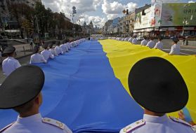Students carry uncompressed flag of Ukraine