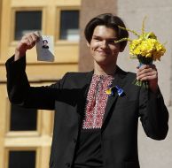 A young man holding a passport