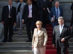 Petr Poroshenko and Angela Merkel