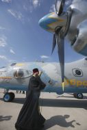 A priest consecrates the AN-26